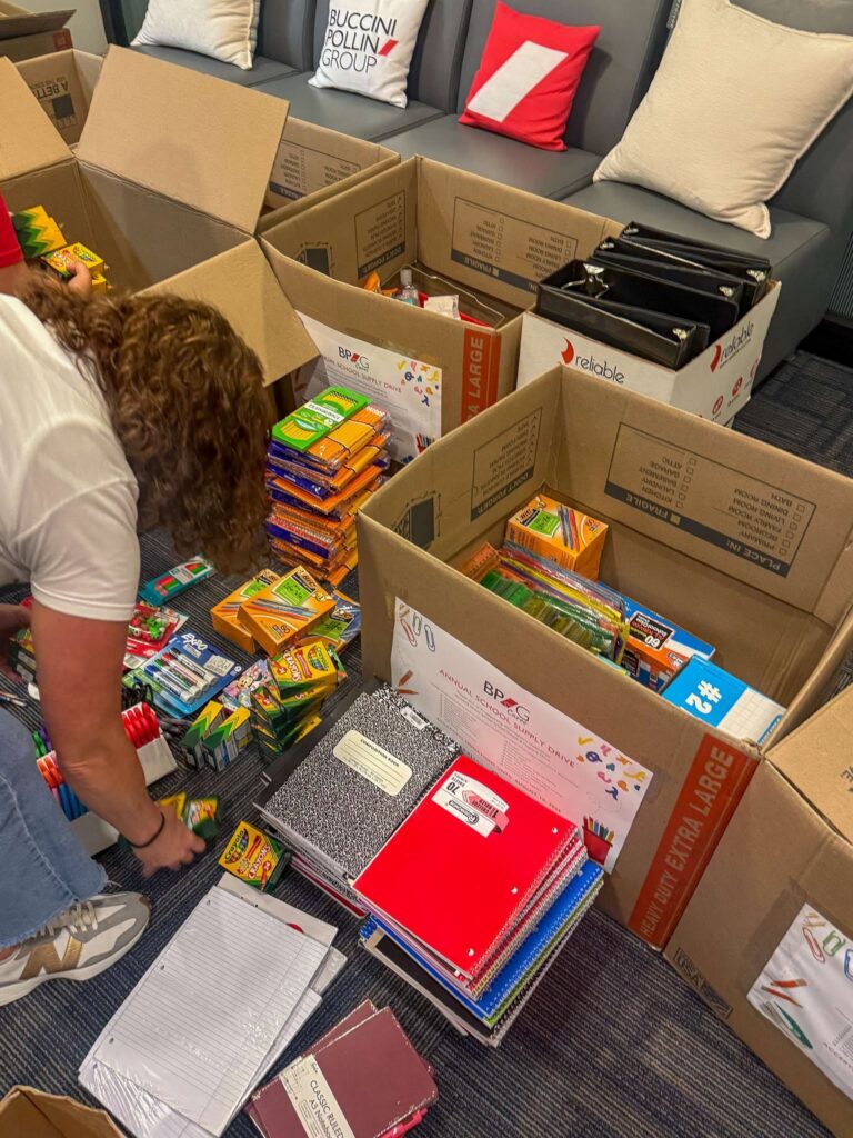 BPG associates sort donated school supplies and hygiene essentials for Wilmington students as part of the 2026 BPG Cares drive.